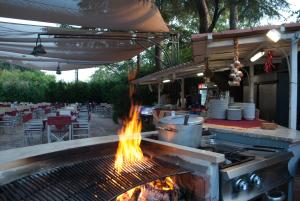 ห้องอาหารหรือที่รับประทานอาหารของ Villaggio Turistico La Mantinera - Appartamenti de Luxe