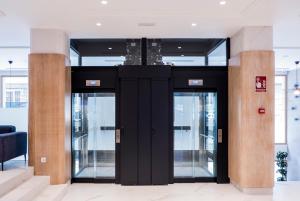 a group of glass doors in a building at Hotel Voramar in Benidorm