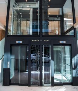 a tall building with revolving doors in a city at Hotel Voramar in Benidorm
