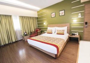 Postel nebo postele na pokoji v ubytování Hotel Bawa Suites
