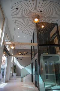 a lobby with two lights and a ceiling at Hotel Voramar in Benidorm