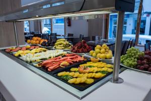a buffet with many different types of fruits and vegetables at Hotel Voramar in Benidorm