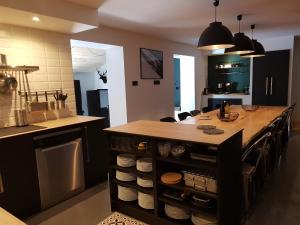 A kitchen or kitchenette at GITE LES TERRASSES 2