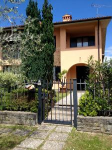 a house with a gate in front of it at B&B Nonna Cecilia in Puegnano del Garda
