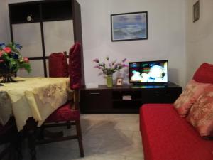 A television and/or entertainment centre at Casa Al Castello