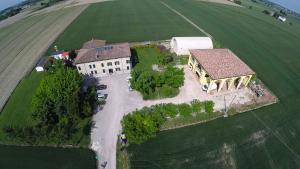 an aerial view of a large house in a field at Corte Galvana in Cento