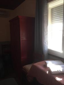 Postel nebo postele na pokoji v ubytování Hotel Le Méditérranée