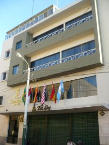 a building with flags in front of it at TERRAMISTICA CENTRO BY Casa Consuelo in Arequipa