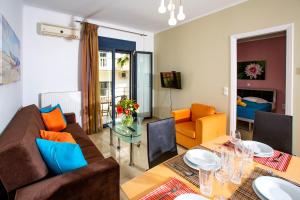 a living room with a couch and a table at Sophia Central Loft & Apartments in Argostoli