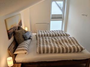 Posteľ alebo postele v izbe v ubytovaní Ferienwohnungen Arp - Haus Anton