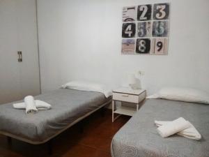 A bed or beds in a room at Casita con Barbacoa