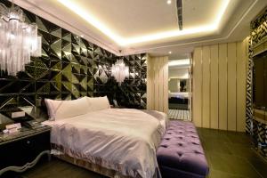 Postel nebo postele na pokoji v ubytování U-Her Hotel