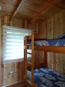 Postel nebo postele na pokoji v ubytování Paraíso Liumalla Lodge