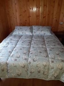 Postel nebo postele na pokoji v ubytování Paraíso Liumalla Lodge