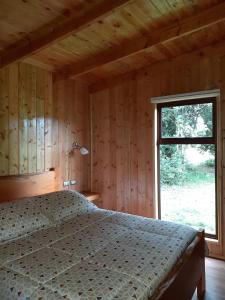 Postel nebo postele na pokoji v ubytování Paraíso Liumalla Lodge