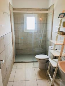 a bathroom with a shower and a toilet and a sink at Apartamentos La Fragata in Es Arenals