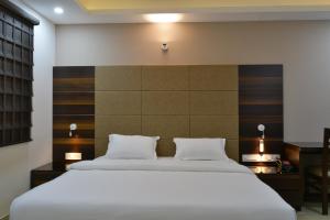 Postel nebo postele na pokoji v ubytování Hotel Tara Palace Redfort
