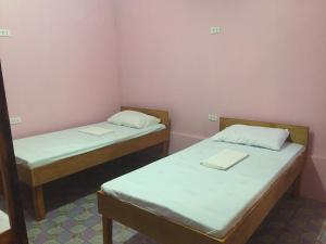 Un ou plusieurs lits dans un hébergement de l'établissement Bohemian Bohol Hostel