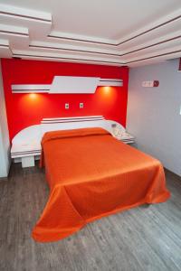 Posteľ alebo postele v izbe v ubytovaní Hotel Ancona - Sólo Adultos