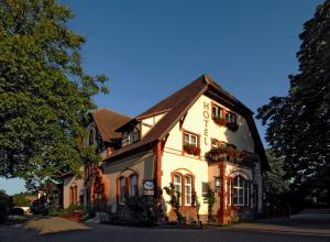 a large house with many windows and plants on it at Villa Knobelsdorff in Pasewalk