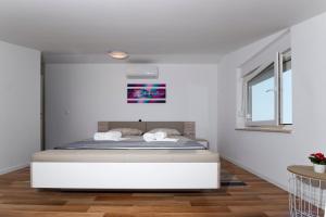 Postel nebo postele na pokoji v ubytování Apartment AleMar