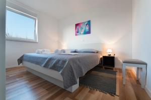 Posteľ alebo postele v izbe v ubytovaní Apartment AleMar