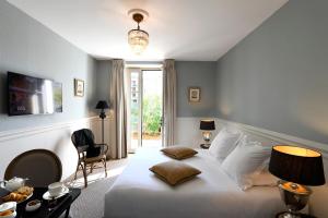 Postel nebo postele na pokoji v ubytování Grand Hôtel Henri - Teritoria