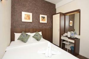 Postel nebo postele na pokoji v ubytování Hotel Westree KL Sentral