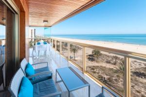a balcony with a view of the beach at Ag Bermudas Deluxe in Gandía