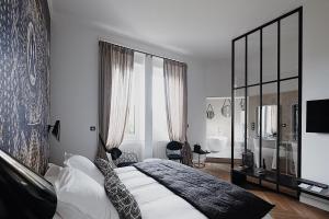 Postel nebo postele na pokoji v ubytování La Villa Guy & Spa - Teritoria