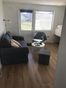 Posezení v ubytování Lägenhet Smågårde Tofta