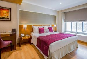 Postel nebo postele na pokoji v ubytování Hotel Bawa Continental