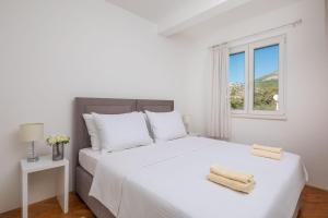 Postel nebo postele na pokoji v ubytování Villa Rozana - Beachfront Wellness Retreat + 37 fotografií
