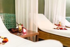 Un ou plusieurs lits dans un hébergement de l'établissement Palais Faraj Suites & Spa