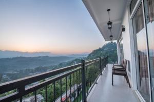 a balcony with a view of the mountains at Beauty Hills in Kandy