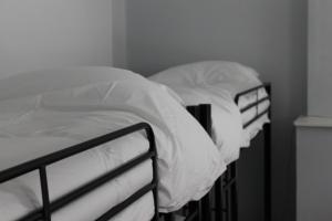 Ένα ή περισσότερα κρεβάτια σε δωμάτιο στο Spoon and the Stars Hostel