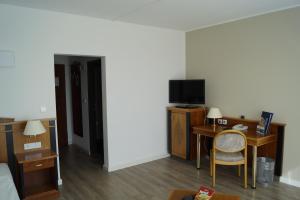 TV a/nebo společenská místnost v ubytování Hotel Novum