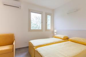 Postel nebo postele na pokoji v ubytování Rose Canine B&B