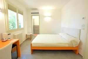 Postel nebo postele na pokoji v ubytování Rose Canine B&B
