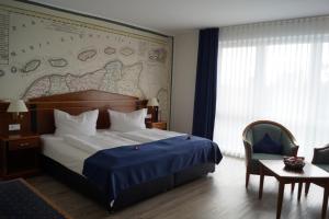 Postel nebo postele na pokoji v ubytování Hotel Novum