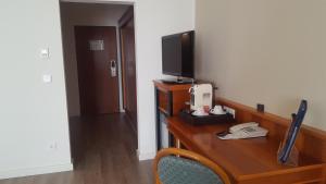 TV a/nebo společenská místnost v ubytování Hotel Novum