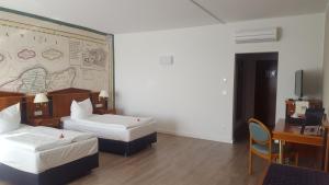 Postel nebo postele na pokoji v ubytování Hotel Novum