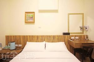 Voodi või voodid majutusasutuse Plum Green Homestay toas
