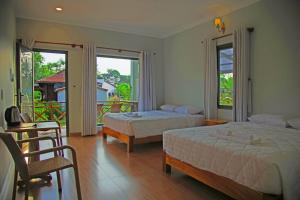 Кровать или кровати в номере Phu Quoc Areca Garden Bungalow