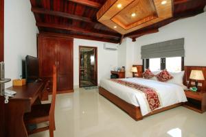 Voodi või voodid majutusasutuse Threeway Riverside Villa toas