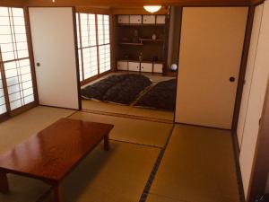 Postel nebo postele na pokoji v ubytování 島の宿 近 〜KON〜