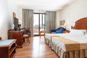 Postel nebo postele na pokoji v ubytování Termes Montbrio Hotel & Spa