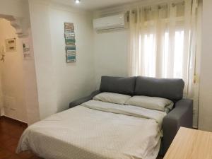 Posteľ alebo postele v izbe v ubytovaní Luchana Apartment