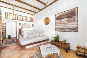 a living room with a couch and a table at Limeri Traditional Guest House in Monólithos