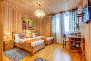 TV a/nebo společenská místnost v ubytování Navat Hotel